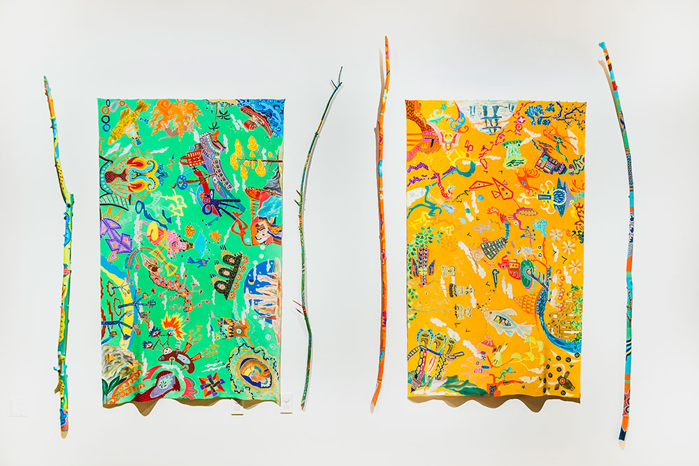 Silk Painting of Doodles displayed with Painted Sticks